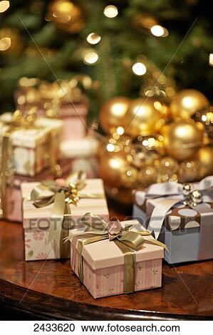 Wrapped Christmas gifts with decorated tree; Montreal, Quebec, Canada View Large Photo Image Stock Image - Wrapped Christmas gifts with decorated tree; Montreal, Quebec, Canada. Fotosearch