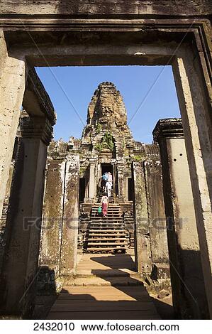 12th century Bayon Temple which is the central temple in Angkor Thom, located north of Angkor Wat; Siem Reap, Cambodia View Large Photo Image Stock Image - 12th century Bayon Temple which is the central temple in Angkor Thom, located north of Angkor Wat; Siem Reap, Cambodia. Fotosearch