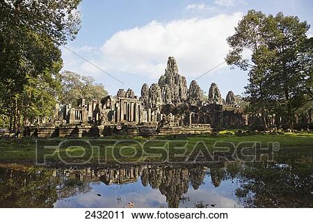 12th century Bayon Temple which is the central temple in Angkor Thom, located north of Angkor Wat; Siem Reap, Cambodia View Large Photo Image Stock Image - 12th century Bayon Temple which is the central temple in Angkor Thom, located north of Angkor Wat; Siem Reap, Cambodia. Fotosearch