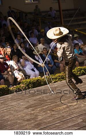 Stock Photo - 14 Year Old Hispanic Charrito (Cowboy) From Mazatlan Performing In Aztec Theater Folkloric Show,; Golden Zone, Mazatlan, Sinaloa State, Mexico. Fotosearch