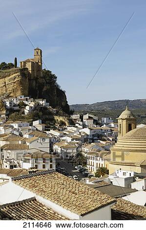 Stock Photograph - 15Th Century Iglesia De La Villa Built On The Site Of A Nasrid Castle With The 18Th Century Iglesia De La Encarnacion On The Lower Right; Montefrio Granada Spain. Fotosearch