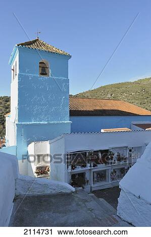 Stock Image - 16Th Century Iglesia De Santa Catalina And Cemetery; Juzcar Malaga Spain. Fotosearch