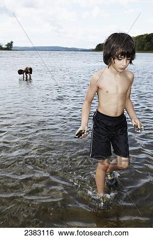 4 and 6 year old playing in the water collecting mussel shells; Montreal, Quebec, Canada View Large Photo Image Stock Photograph - 4 and 6 year old playing in the water collecting mussel shells; Montreal, Quebec, Canada. Fotosearch