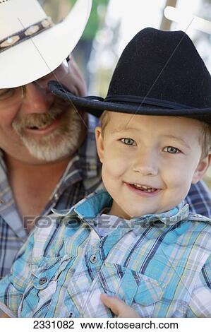 55 Year Old Man With 4 Year Old Boy In Cowboy Hats Langley British Columbia Canada Stock Image 2331082 Fotosearch