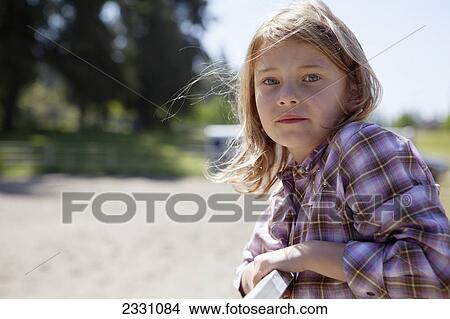 7-Year-Old Girl In Plaid Shirt Outdoors; Langley British Columbia Canada View Large Photo Image Picture - 7-Year-Old Girl In Plaid Shirt Outdoors; Langley British Columbia Canada. Fotosearch
