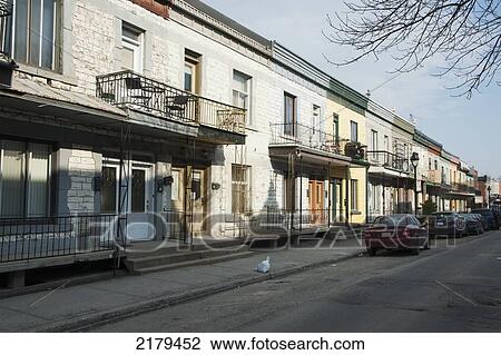Stock Image - A Bag Of Garbage Left On The Curb Outside A Residential Building; Montreal Quebec Canada. Fotosearch