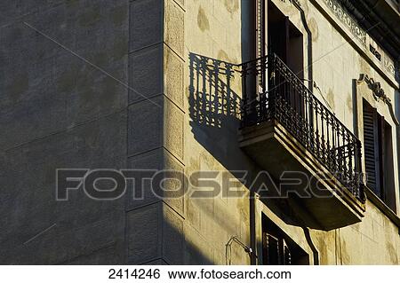 A balcony on the side of a residential building in the sunlight; Barcelona, Spain View Large Photo Image Stock Photograph - A balcony on the side of a residential building in the sunlight; Barcelona, Spain. Fotosearch