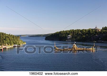 Stock Image - A Barge Crossing The Entrance Of The Fjord; Stockholm, Sweden. Fotosearch
