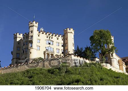 Picture - A Bavarian Castle On A Hillside With A Blue Sky; Fussen, Germany. Fotosearch