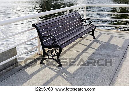 A bench beside a railing at the water's edge; Nanaimo, British Columbia, Canada View Large Photo Image Stock Image - A bench beside a railing at the water's edge; Nanaimo, British Columbia, Canada. Fotosearch
