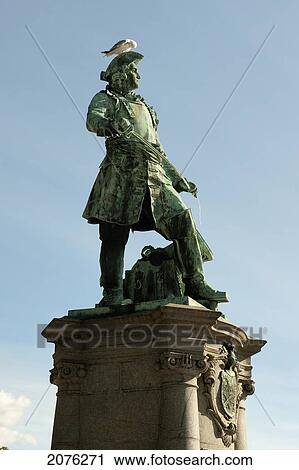 Stock Image - A Bird Perched On A War Hero Statue; Oslo Norway. Fotosearch
