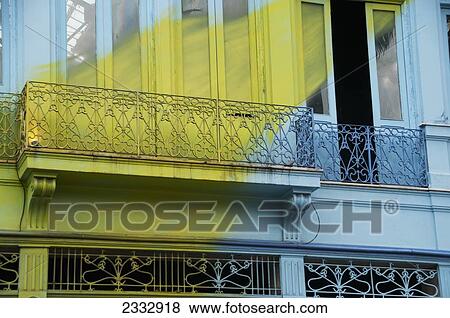 Stock Photo - A Blue Building With A Painted Yellow Streak Across It In The Lapa Neighbourhood; Rio De Janeiro, Brazil. Fotosearch
