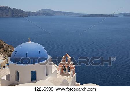 A blue domed church and pink bell tower overlooking the caldera; Oia, Santorini, Cyclades, Greek Islands, Greece View Large Photo Image Stock Image - A blue domed church and pink bell tower overlooking the caldera; Oia, Santorini, Cyclades, Greek Islands, Greece. Fotosearch