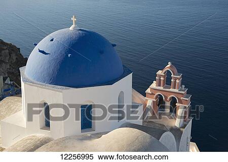 A blue domed church and pink bell tower overlooking the caldera; Oia, Santorini, Cyclades, Greek Islands, Greece View Large Photo Image Stock Photography - A blue domed church and pink bell tower overlooking the caldera; Oia, Santorini, Cyclades, Greek Islands, Greece. Fotosearch