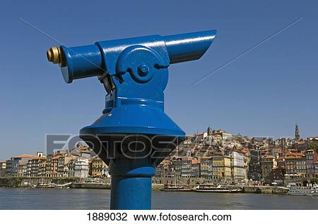 Stock Image - A Blue Tourist Telescope Beside The Quayside At Oporto. Fotosearch