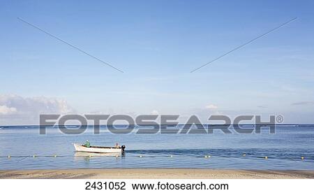 A boat close to the sandy shore with a view of the horizon on the Indian Ocean; Mauritius View Large Photo Image Stock Image - A boat close to the sandy shore with a view of the horizon on the Indian Ocean; Mauritius. Fotosearch