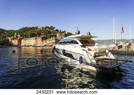 Stock Image - A boat in the harbour; Portofino, Liguria, Italy. Fotosearch