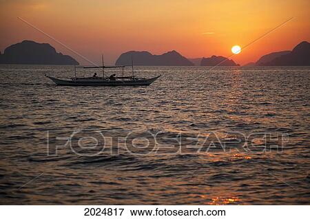 A Boat In The Water Off The Beach Of Corong Corong At Sunset; Corong Corong Bacuit Archipelago Palawan Philippines View Large Photo Image Stock Photo - A Boat In The Water Off The Beach Of Corong Corong At Sunset; Corong Corong Bacuit Archipelago Palawan Philippines. Fotosearch