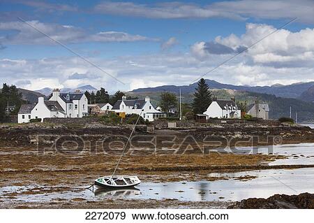 A Boat Lays In The Shore At Low Tide With Houses Along The Coastline; Plockton Highlands Scotland View Large Photo Image Stock Photo - A Boat Lays In The Shore At Low Tide With Houses Along The Coastline; Plockton Highlands Scotland. Fotosearch