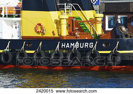 A boat lined with rubber tires on the side; Hamburg, Germany View Large Photo Image Stock Photography - A boat lined with rubber tires on the side; Hamburg, Germany. Fotosearch