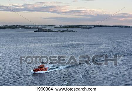 Picture - A Boat Navigating Through A Waterway In The Baltic Sea; Stockholm, Sweden. Fotosearch