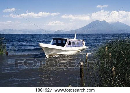 A Boat On A Boat Tour Gliding Over Water. View Large Photo Image Stock Photo - A Boat On A Boat Tour Gliding Over Water.. Fotosearch