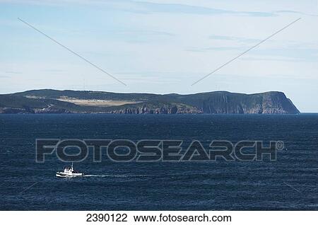 A boat on the water in Cape Spear; St. John's, Newfoundland and Labrador, Canada View Large Photo Image Stock Image - A boat on the water in Cape Spear; St. John's, Newfoundland and Labrador, Canada. Fotosearch