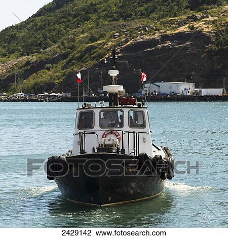 A boat with Canadian flags in a harbour; St. John's, Newfoundland, Canada View Large Photo Image Stock Image - A boat with Canadian flags in a harbour; St. John's, Newfoundland, Canada. Fotosearch
