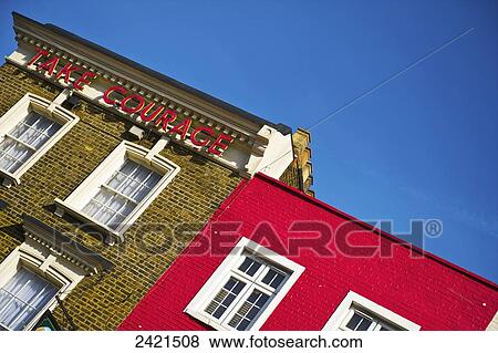A brick building with a sign that says take courage, Camden; London, England View Large Photo Image Stock Photo - A brick building with a sign that says take courage, Camden; London, England. Fotosearch