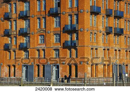 A brick building with random placement of balconies; Hamburg, Germany View Large Photo Image Stock Photo - A brick building with random placement of balconies; Hamburg, Germany. Fotosearch