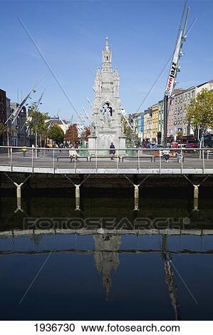 Stock Image - A Bridge And Buildings At The Mall Reflected Into River Lee; Cork City County Cork Ireland. Fotosearch