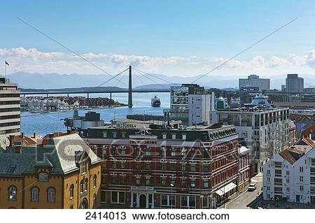 Stock Image - A bridge crosses the Stavanger peninsula with buildings in the foreground; Stavanger, Norway. Fotosearch