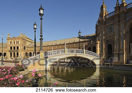 Stock Photograph - A Bridge Over A Waterway At The Plaza De Espana; Seville Andalusia Spain. Fotosearch