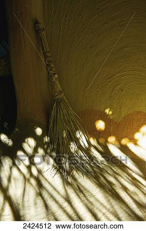 A broom leaning against a wall; Ulpotha, Embogama, Sri Lanka View Large Photo Image Stock Image - A broom leaning against a wall; Ulpotha, Embogama, Sri Lanka. Fotosearch