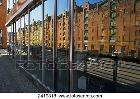 A brown brick building and street reflected in the windows of a building; Hamburg, Germany View Large Photo Image Stock Photo - A brown brick building and street reflected in the windows of a building; Hamburg, Germany. Fotosearch