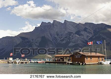 Stock Photo - A Building And Docks For Taking Boats Out Into A Mountain Lake; Banff Alberta Canada. Fotosearch