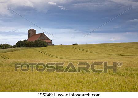 Stock Image - A Building And Farmland; St. Abb's Head Scottish Borders Scotland. Fotosearch