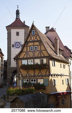 A Building And Tower With A Clock; Rothenburg Ob Der Tauber Bavaria Germany View Large Photo Image Stock Photograph - A Building And Tower With A Clock; Rothenburg Ob Der Tauber Bavaria Germany. Fotosearch