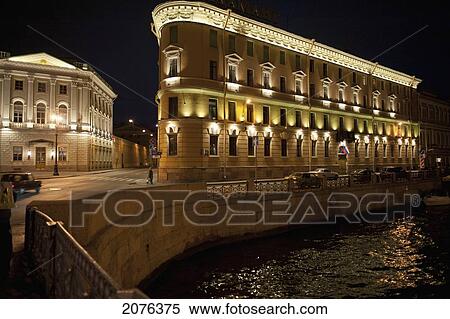 A Building Illuminated At Night On The Edge Of Moyka River; St. Petersburg Russia View Large Photo Image Stock Photography - A Building Illuminated At Night On The Edge Of Moyka River; St. Petersburg Russia. Fotosearch