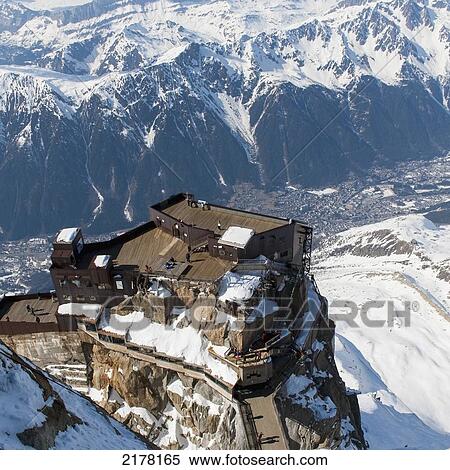 Stock Photography - A Building On The Top And Edge Of A Mountain; Chamonix-Mont-Blanc Rhone-Alpes France. Fotosearch