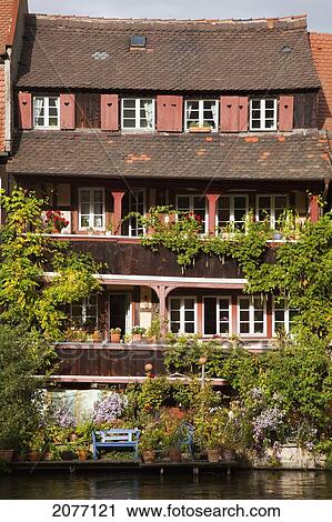 A Building On The Water's Edge Of River Regnitz; Bamberg Bavaria Germany View Large Photo Image Stock Image - A Building On The Water's Edge Of River Regnitz; Bamberg Bavaria Germany. Fotosearch