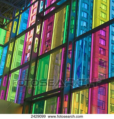 Stock Photo - A building view through multi-coloured glass in a window; Montreal, Quebec, Canada. Fotosearch