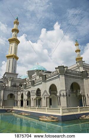 Picture - A Building With Towers Water Around It; Kuala Lumpur, Malaysia. Fotosearch