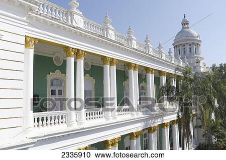 A Building With White Columns, Railing And Balusters And A Green Interior Corridor View Large Photo Image Stock Image - A Building With White Columns, Railing And Balusters And A Green Interior Corridor. Fotosearch