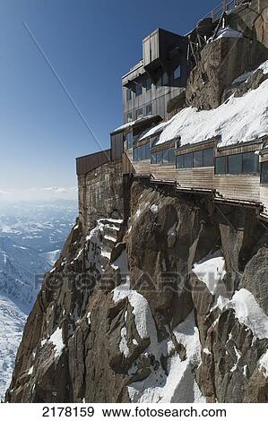 A Building With Windows Built Into The Mountain Of The French Alps; Chamonix-Mont-Blanc Rhone-Alpes France View Large Photo Image Stock Photo - A Building With Windows Built Into The Mountain Of The French Alps; Chamonix-Mont-Blanc Rhone-Alpes France. Fotosearch