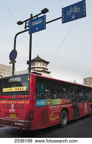 A Bus Driving In The Bus Lane On A Road; Xi'an, Shaanxi, China View Large Photo Image Stock Photo - A Bus Driving In The Bus Lane On A Road; Xi'an, Shaanxi, China. Fotosearch