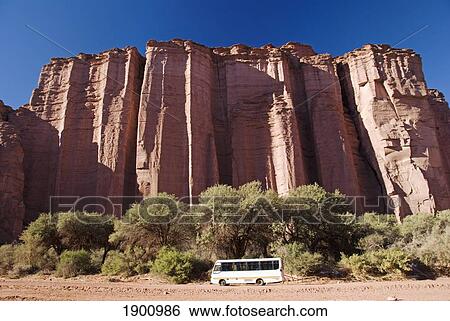 A Bus In Talampaya National Park In Front Of A Rock Formation; La Rioja, Argentina View Large Photo Image Stock Photograph - A Bus In Talampaya National Park In Front Of A Rock Formation; La Rioja, Argentina. Fotosearch