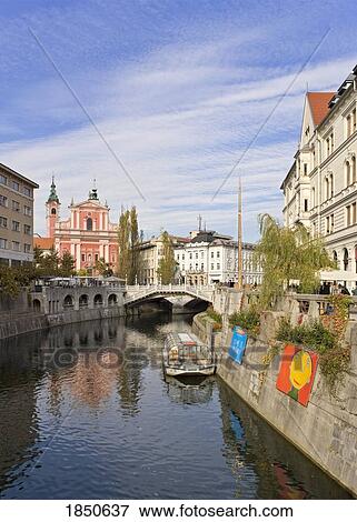 Stock Photo - A Canal Going Through A City. Fotosearch