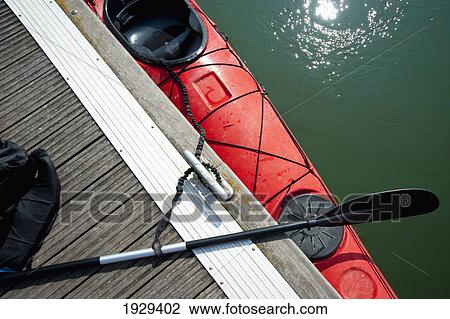 A canoe and oar alongside a dock; Catalonia, Spain View Large Photo Image Stock Image - A canoe and oar alongside a dock; Catalonia, Spain. Fotosearch