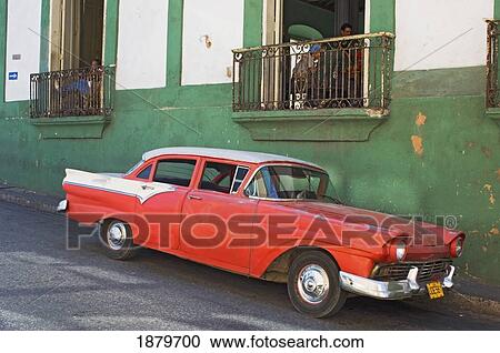 Stock Image - A Car Outside A Chess Club In Santiago De Cuba.. Fotosearch